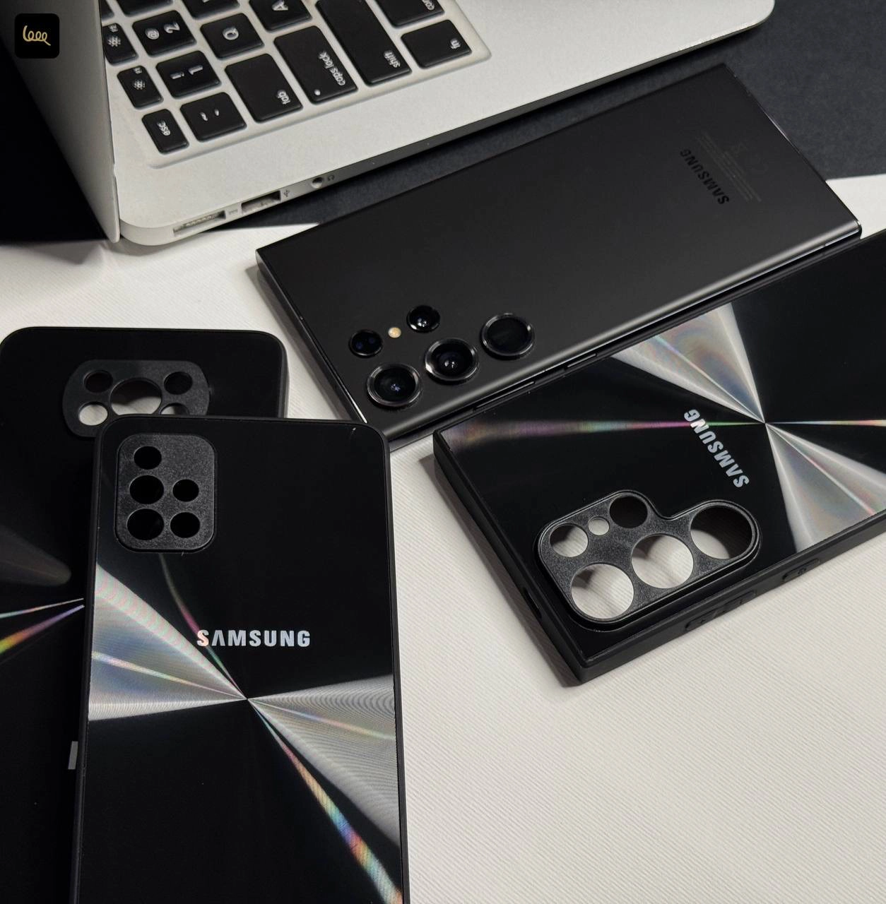 قاب گوشی لیزری مشکی کلاسیک با طرح لیزری روی بدنه و لبه‌های محافظ دوربین برای مدل‌های سامسونگ، شیائومی و آیفون