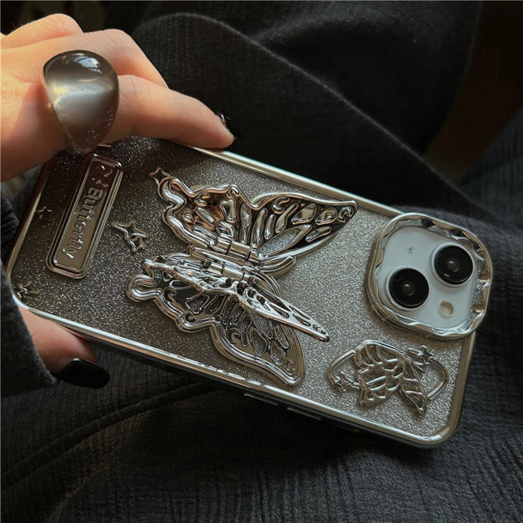 قاب آیفون Butterfly Stand Case متالیک با پروانه فلزی استندی و بال‌های متحرک روی زمینه شاین نقره‌ای