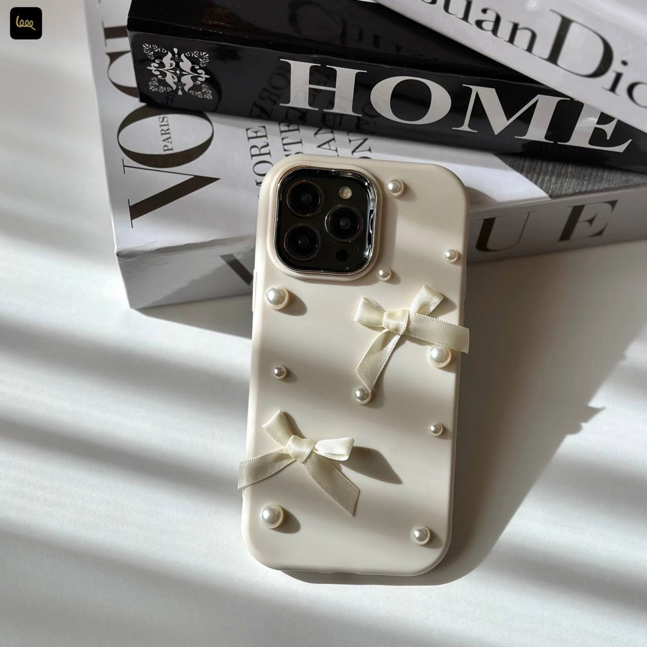 قاب آیفون چُبی پاپیونی Chubby Bowtie با روبان و مروارید برجسته در دو رنگ سفید صدفی و صورتی ملایم