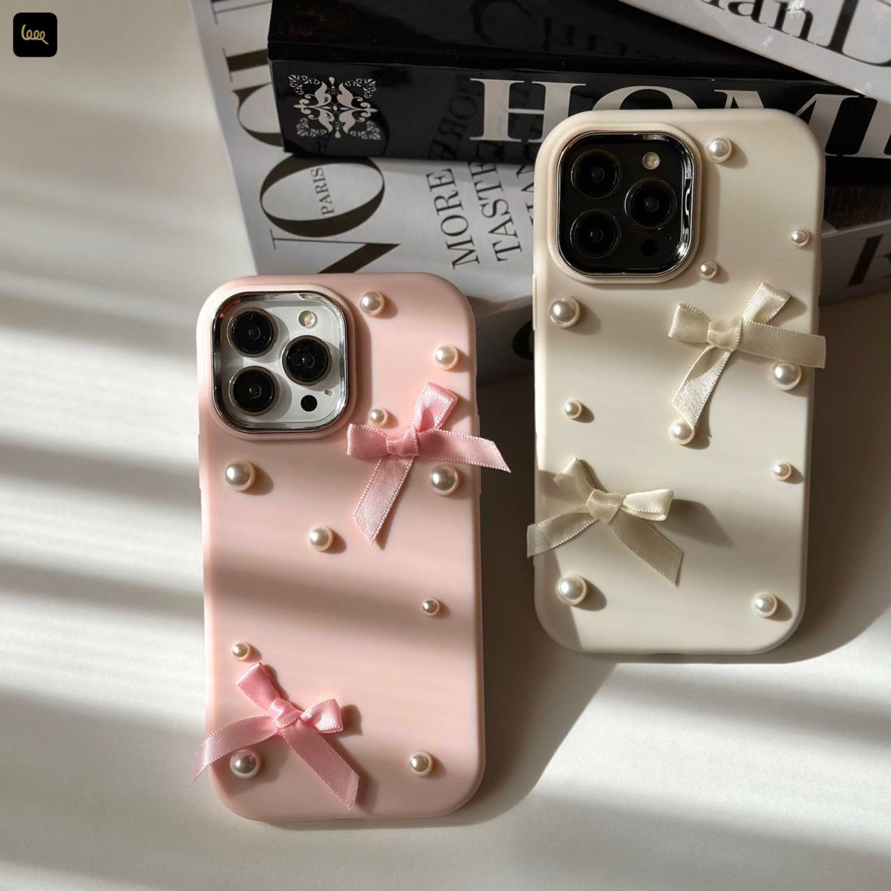قاب آیفون چُبی پاپیونی Chubby Bowtie با روبان و مروارید برجسته در دو رنگ سفید صدفی و صورتی ملایم