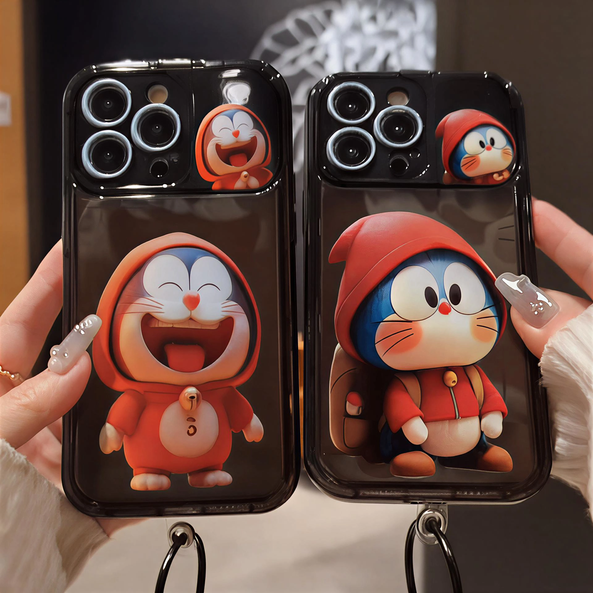 قاب آیفون Doraemon Hoodie مشکی با طرح دورامون به همراه آویز