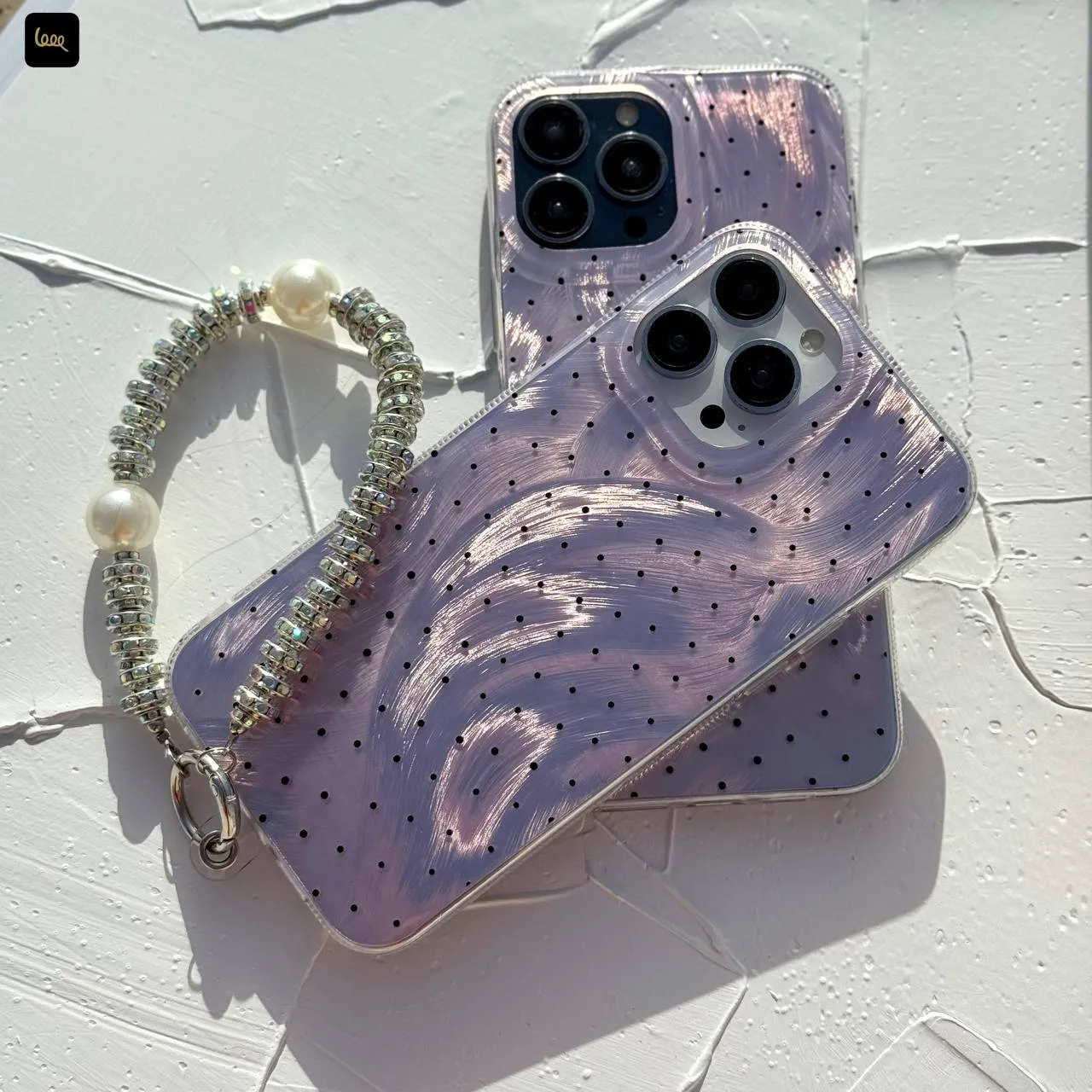 قاب گوشی آیفون طرح موج و نقطه بنفش لیلاک مدل Imd wave Dots Lilac به همراه بند مهره ای لوکس قاب گوشی آیفون طرح موج و نقطه بنفش لیلاک مدل Imd wave Dots Lilac به همراه بند مهره ای لوکس